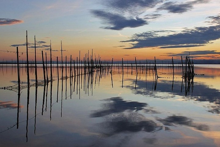 a sunset over a body of water