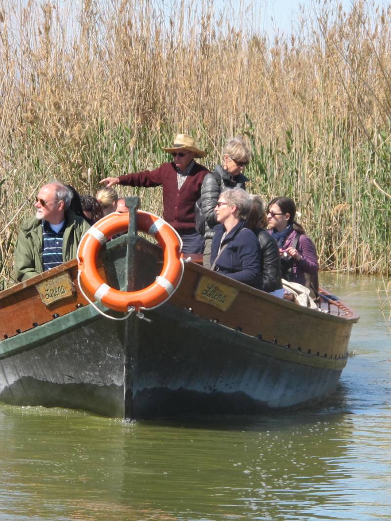a group of people riding on a boat in the water